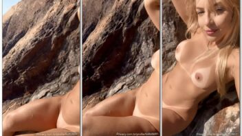 Natalia R, a loirinha bonequinha, faz um striptease na praia de nudismo