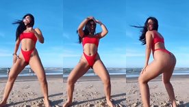 Francielly Araujo dançando de biquíni na praia lotada