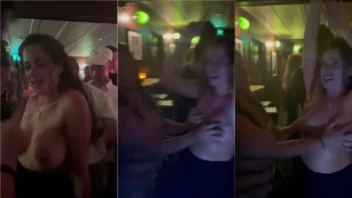 Mulher gata mostrando os peitões na balada